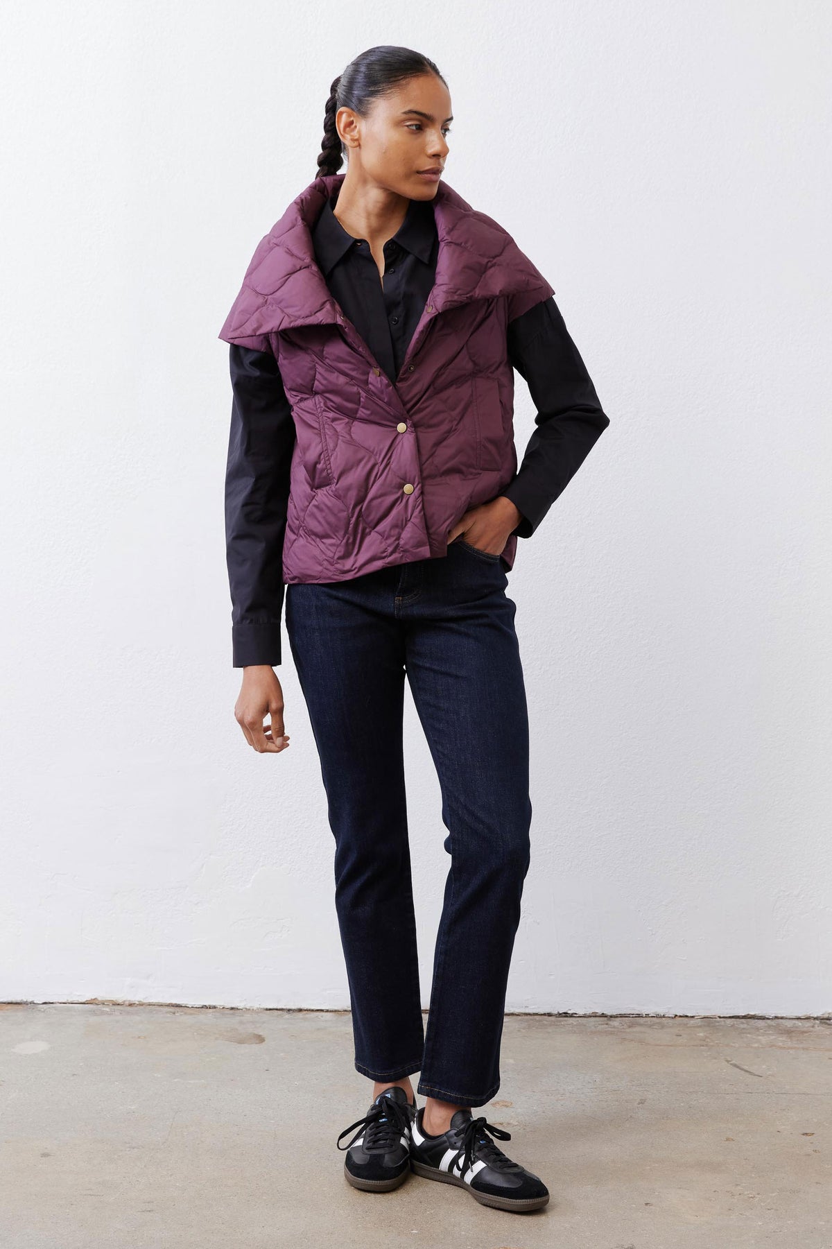 Deep plum quilted down vest with stand collar and front snap buttons