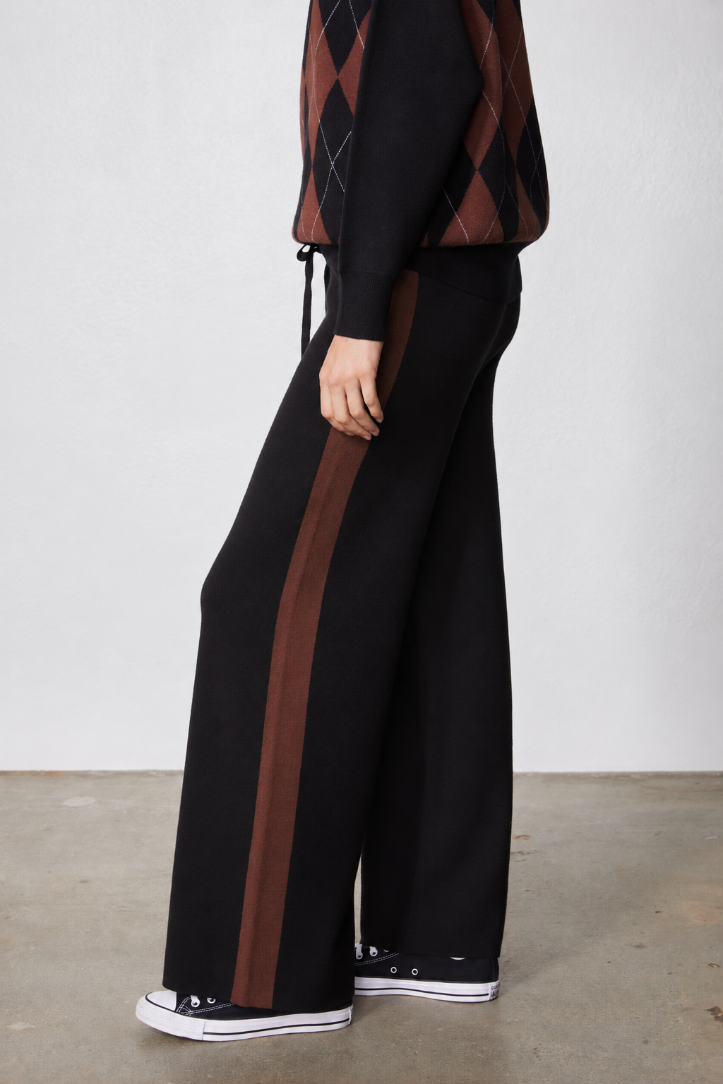 Black wide-leg lounge pants with brown vertical side stripe