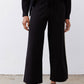 Black wide-leg lounge pants with drawstring waist and long ivory side stripe