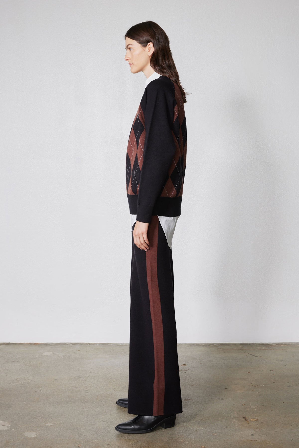 Black wide-leg lounge pants with chestnut vertical stripe