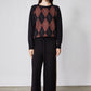 Black lounge pants with wide legs and chestnut stripe; drawstring waist