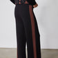 Black lounge pants with chestnut side stripe and flared wide hem