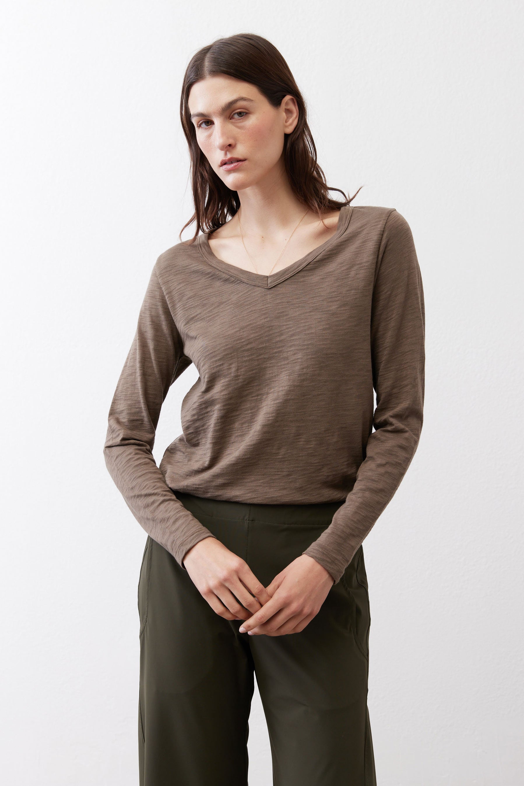 Swing V-neck top in brown with long sleeves and draped V neckline