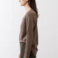 Brown long-sleeve V-neck top, side view
