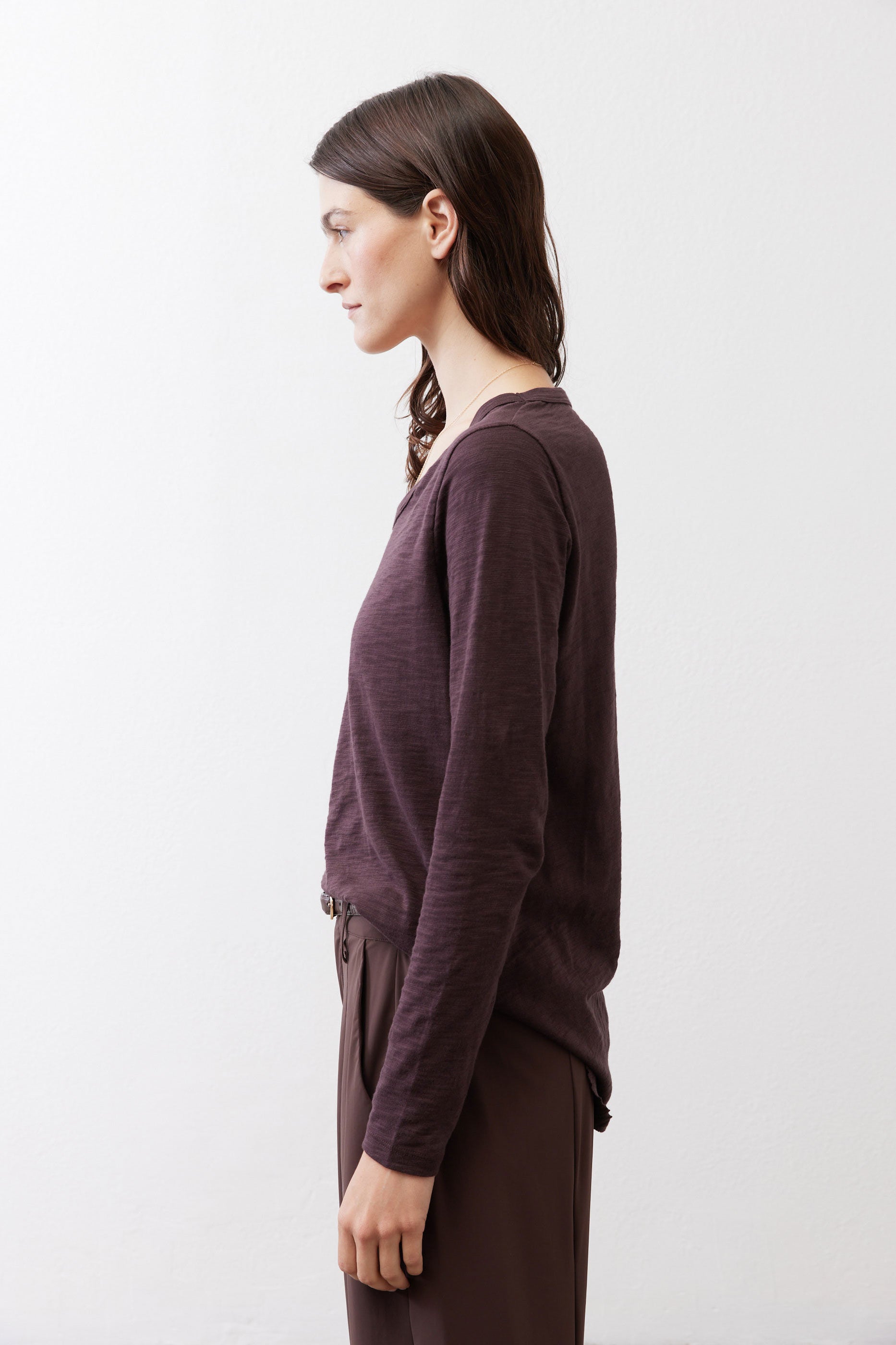 Coffee-brown V-neck long-sleeve top with side drape and long cuffed sleeves