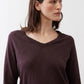 Coffee-brown V-neck long-sleeve top with wide neckline and draped sleeves