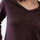 Coffee-brown V-neck long-sleeve top with wide neckline and fine heather texture