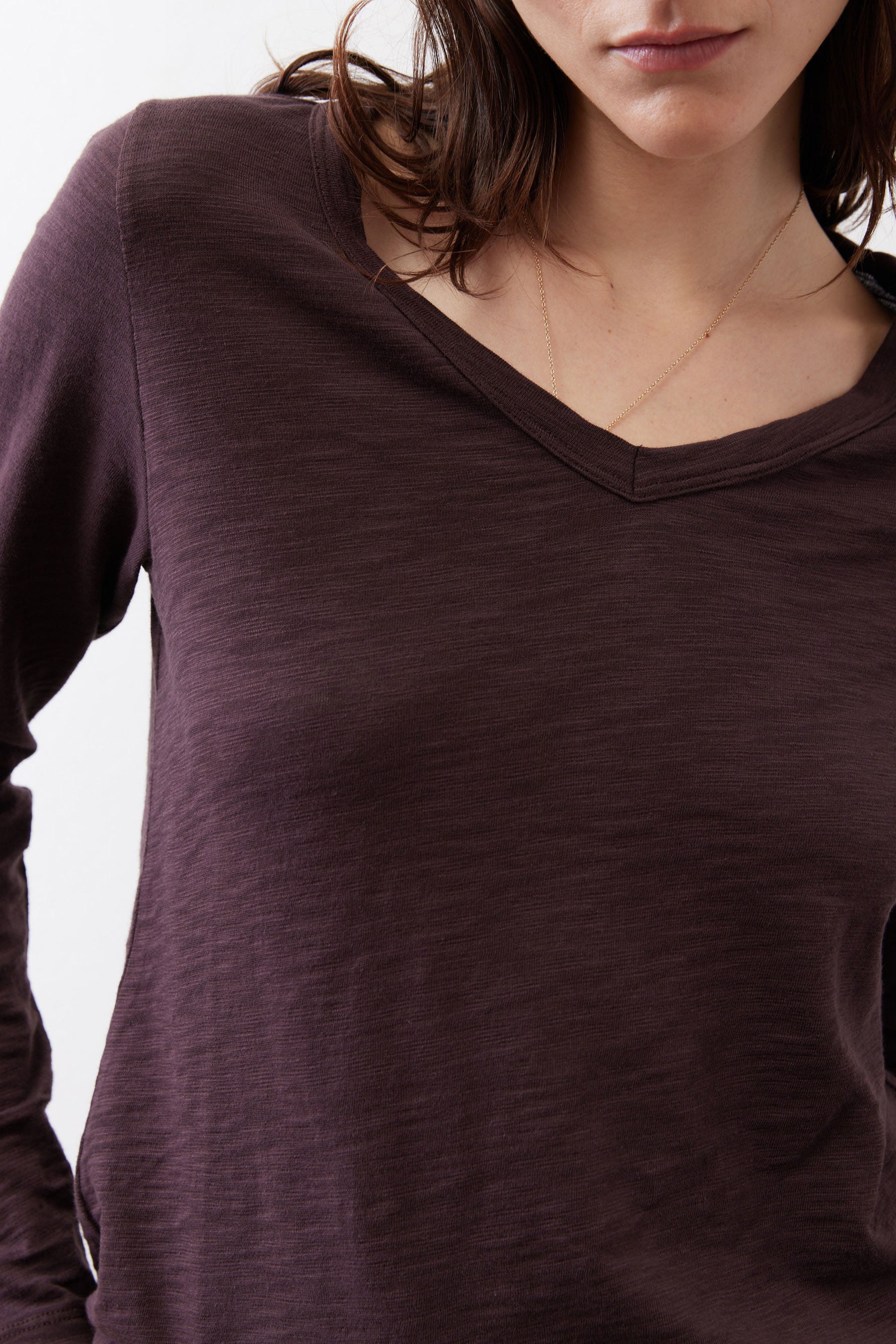 Coffee-brown V-neck long-sleeve top with wide neckline and fine heather texture