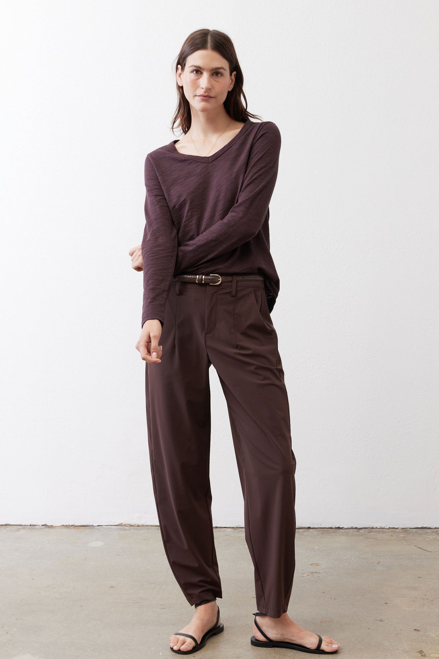 Coffee-brown V-neck long-sleeve top with relaxed drape and V-shaped neckline