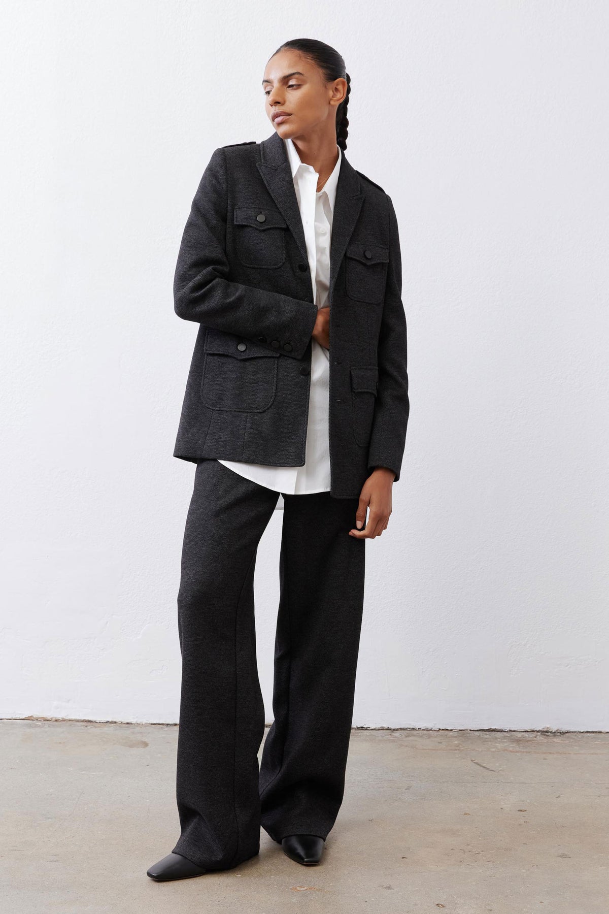 Charcoal straight-leg tailored pants, side view with belt loops and patch pockets