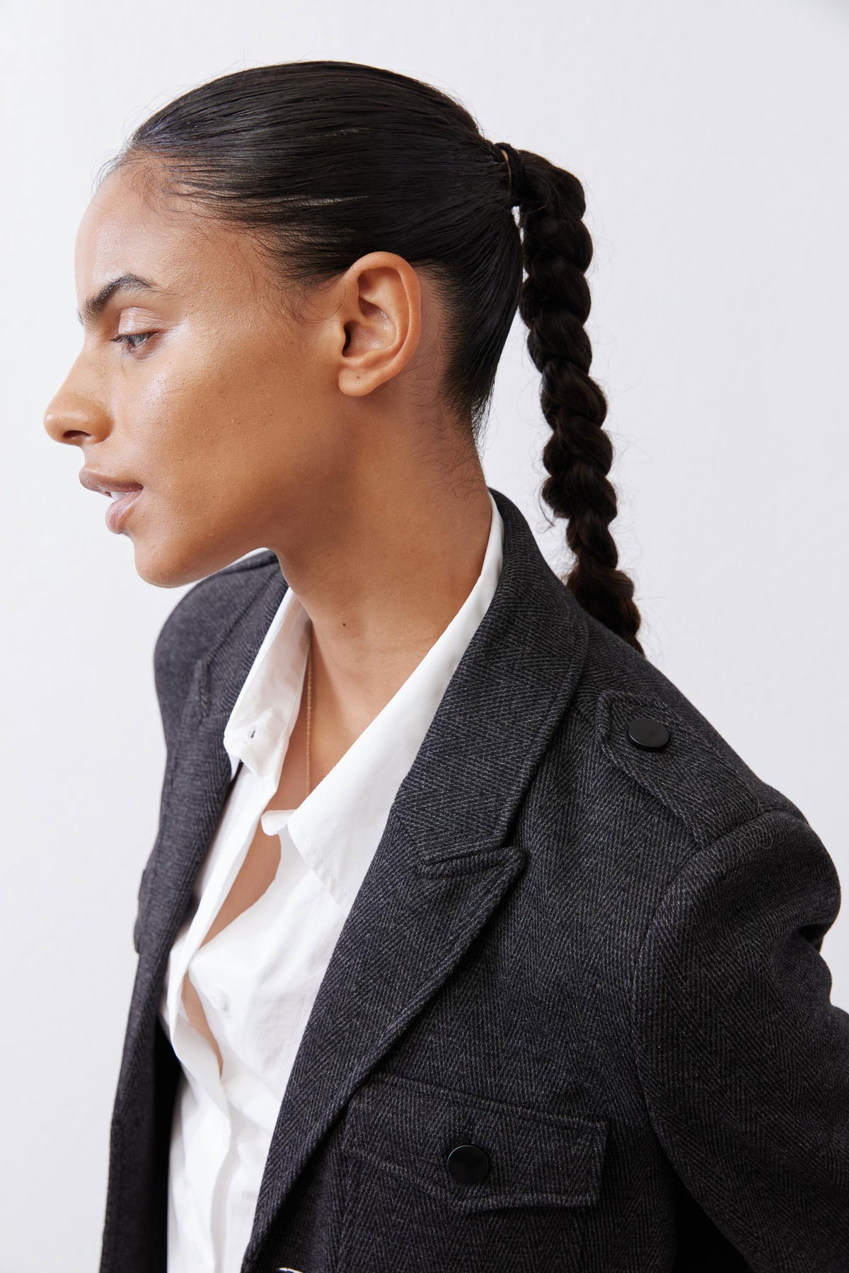 Charcoal herringbone blazer collar and flap pocket with button closure
