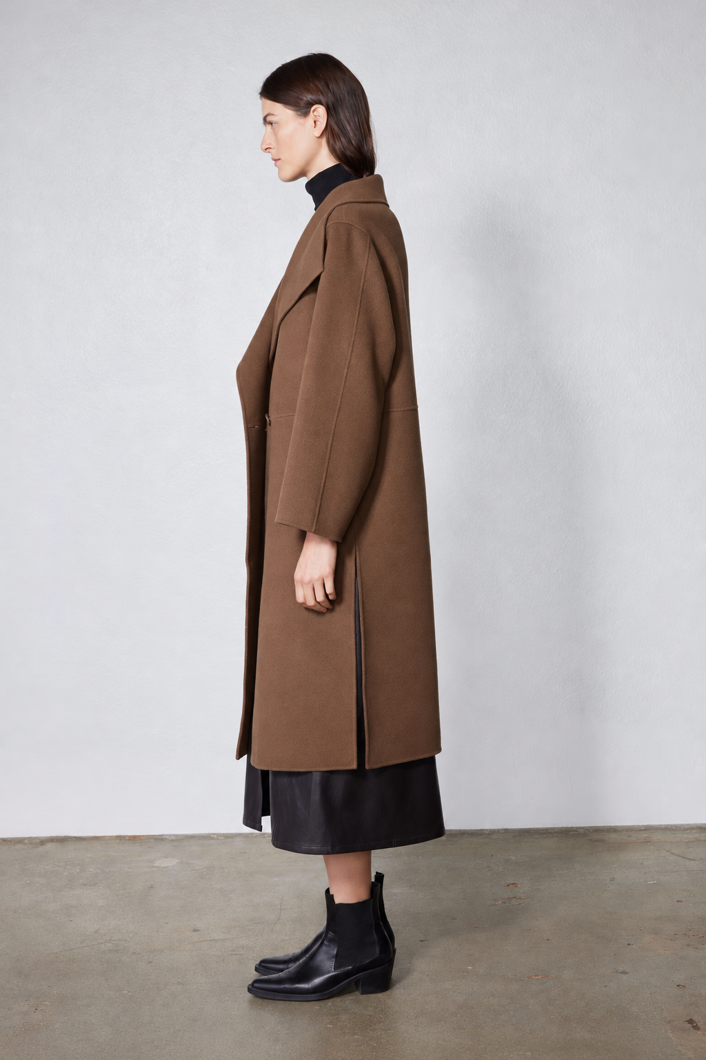 Dark taupe oversized wool coat, side view with notch collar and front button detail