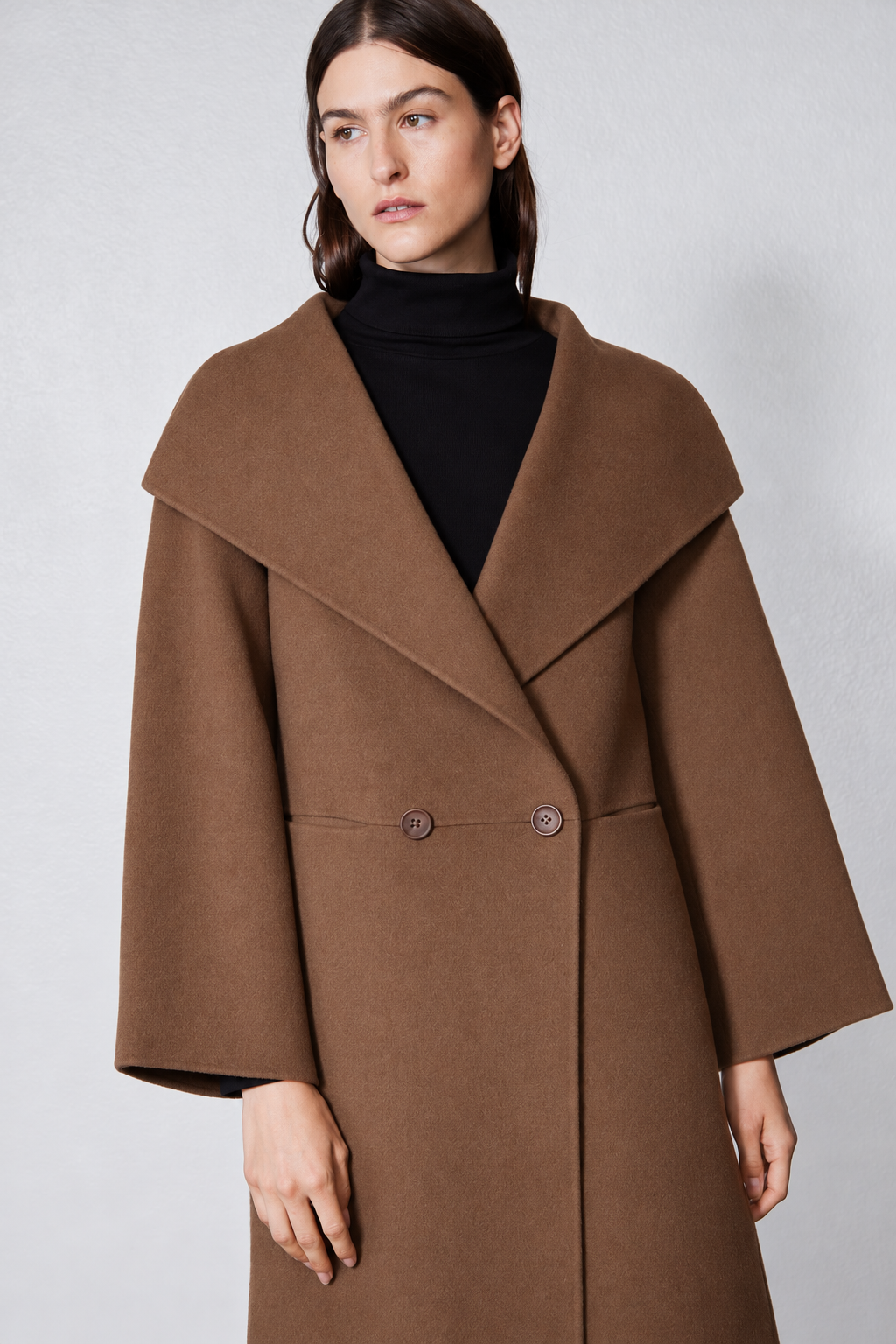 Dark taupe oversized wool coat with notched collar, buttoned placket, flap pockets