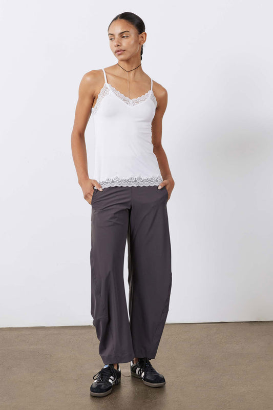White lace-trim cami with spaghetti straps and scalloped lace hem, front view