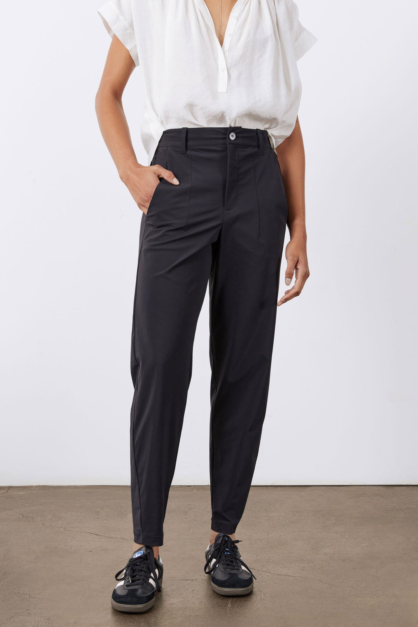 Black not-too-tapered pants with zip fly and button closure