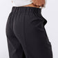 Black elastic-waist pants with side pockets and relaxed fit