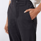 Black not-too-tapered pants with button closure and front pockets