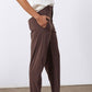 Coffee-brown relaxed tapered pants with front pockets and belt loops