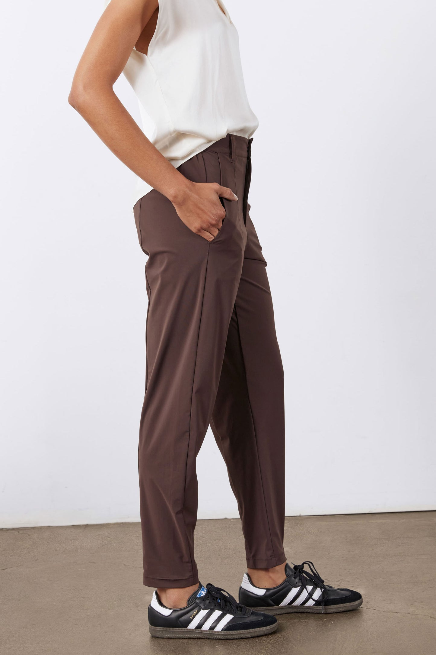Coffee-brown relaxed tapered pants with front pockets and belt loops