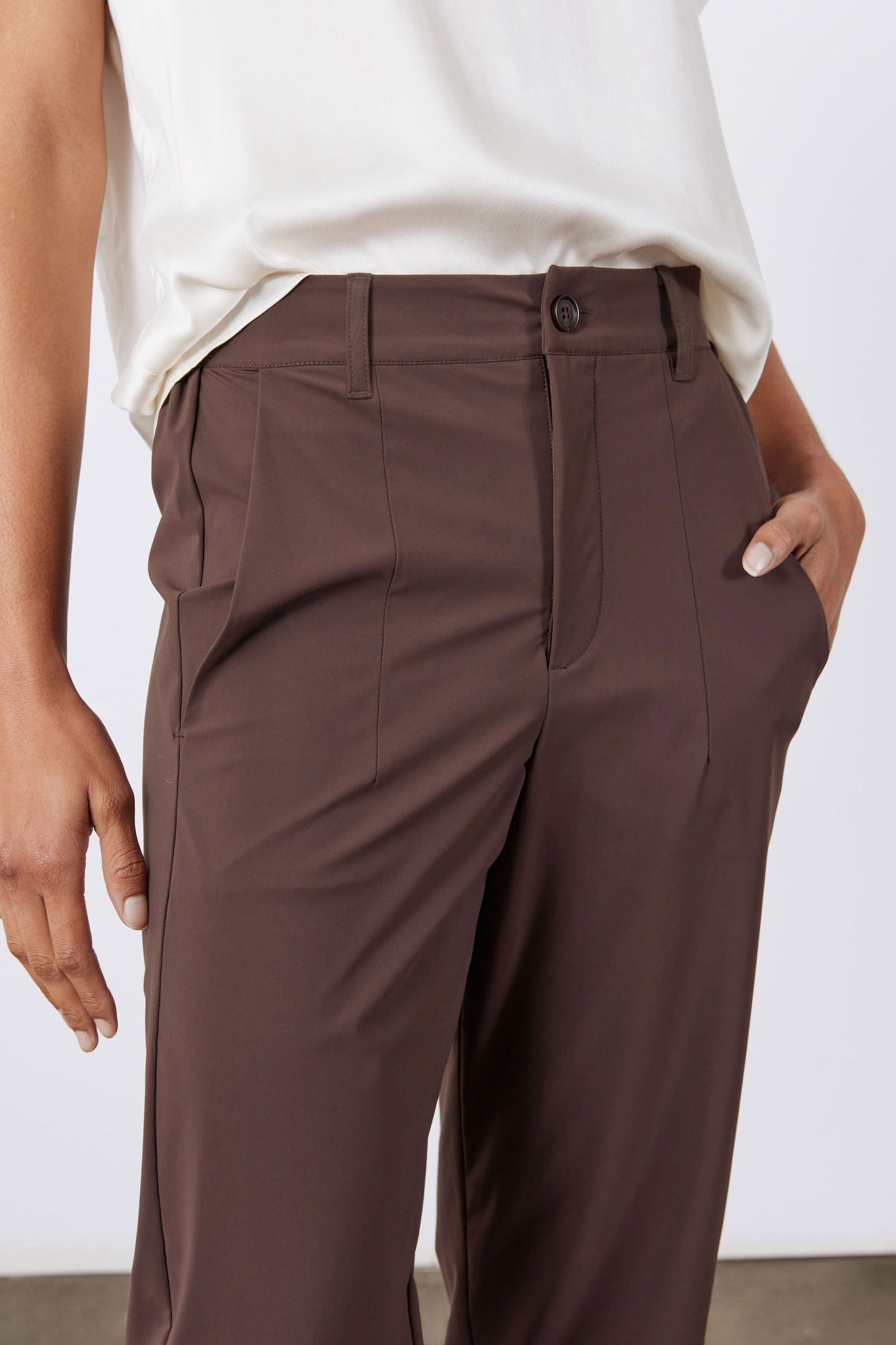 Coffee-brown pants with button closure, front pockets, and belt loops
