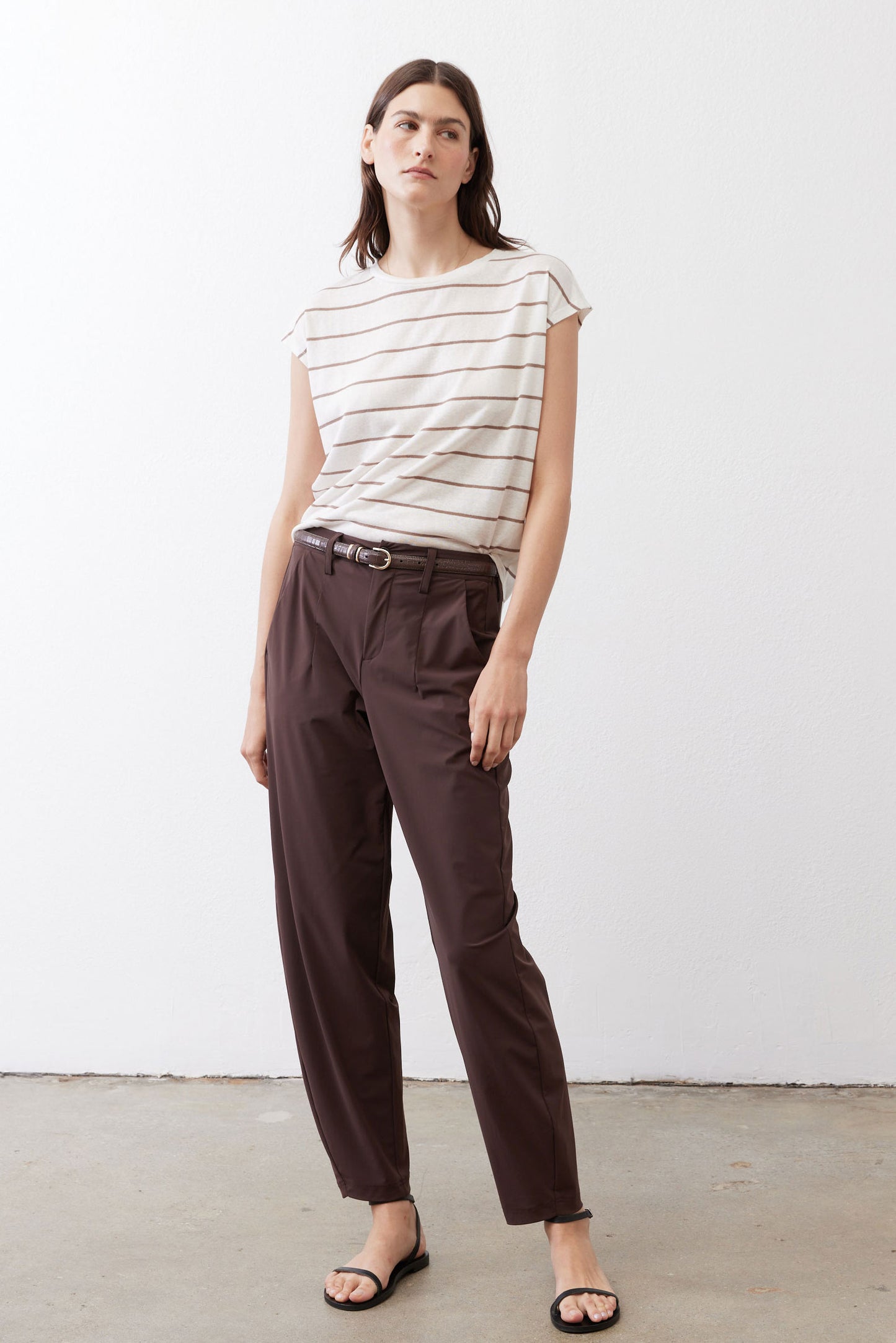 Striped crew-neck T-shirt with off-white fabric and brown horizontal stripes, short sleeves.