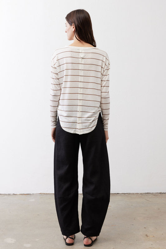 Striped long-sleeve top viewed from back, off-white with tan horizontal stripes.