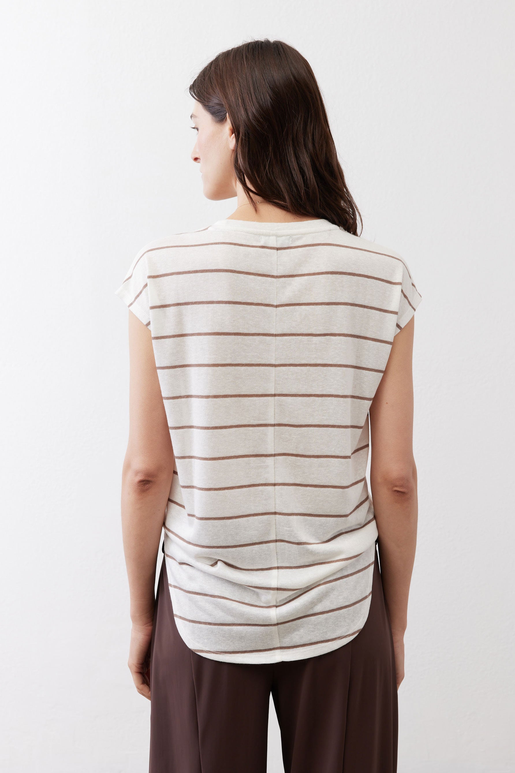 Back of striped T-shirt in off-white with brown horizontal stripes, short sleeves.