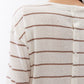Back of striped long-sleeve top with horizontal tan lines and button placket