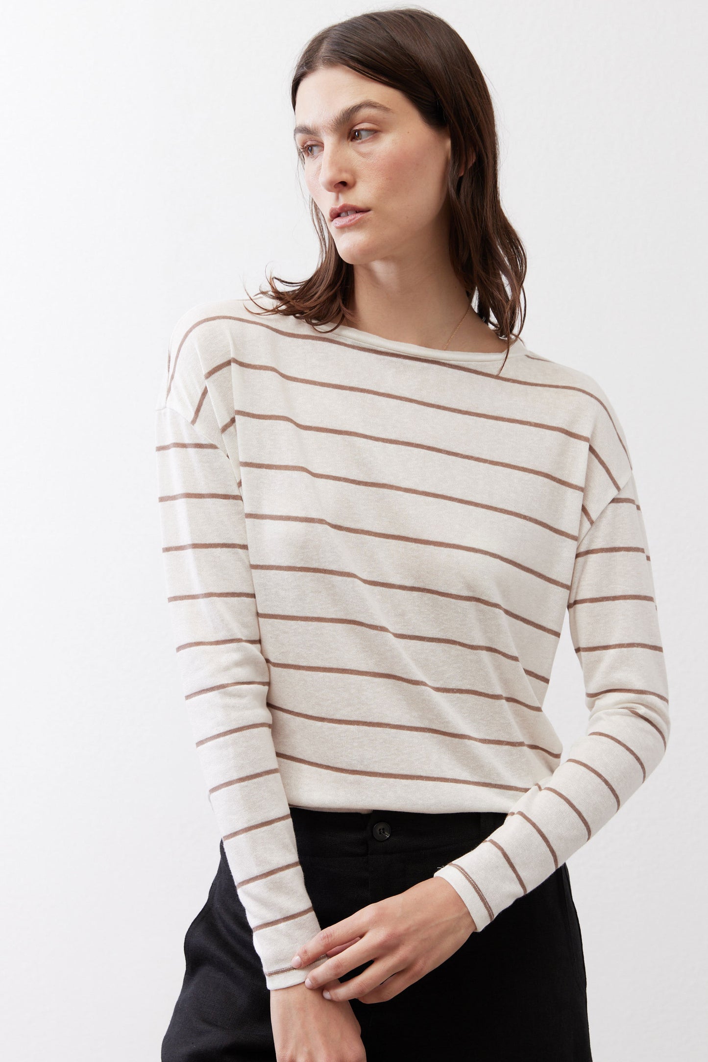 Striped long-sleeve top with crew neck, banded stripes, and slim cuffs