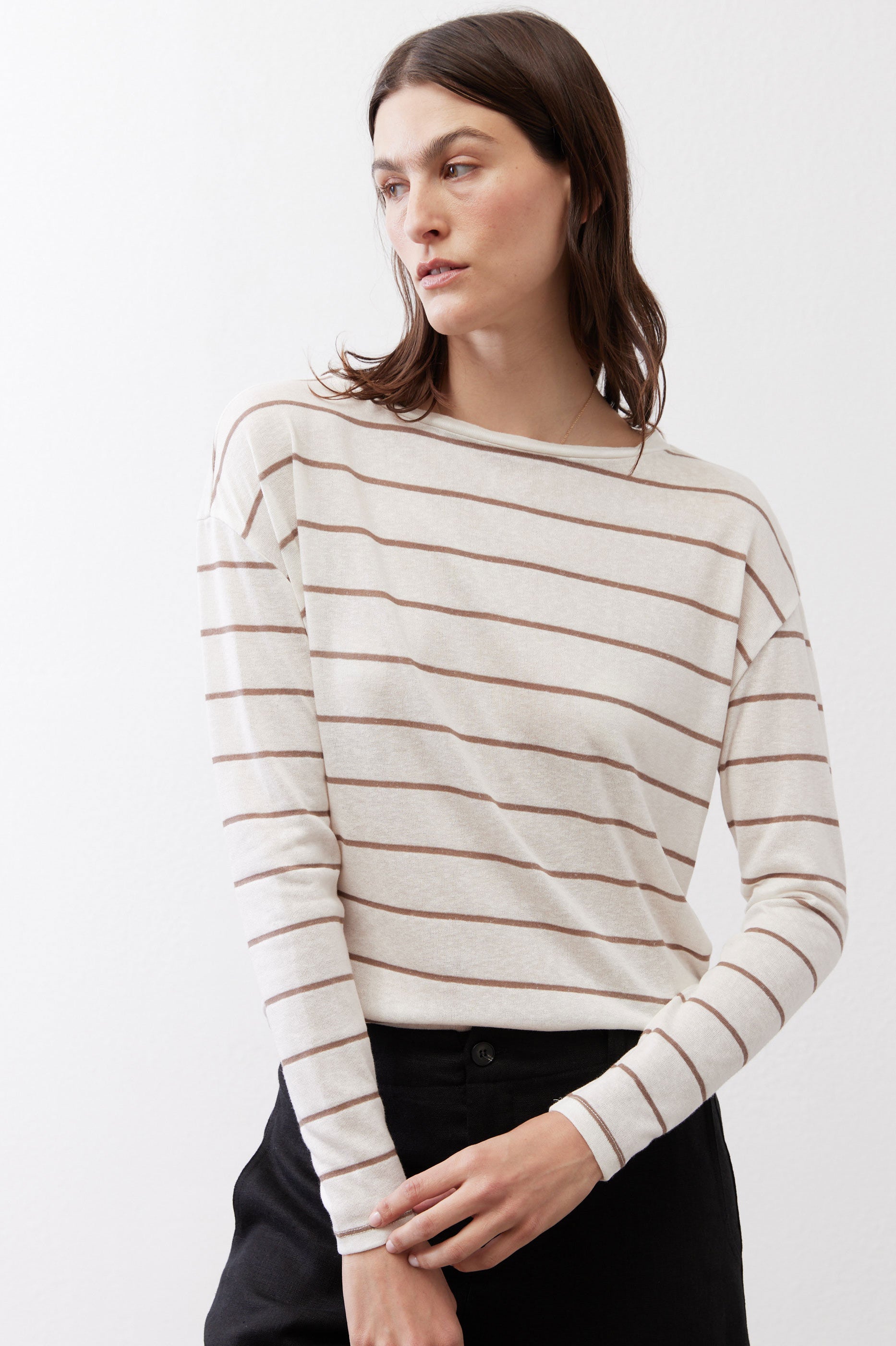 Striped long-sleeve top with crew neck, banded stripes, and slim cuffs
