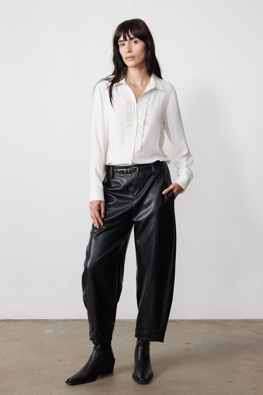 Off-white button-front blouse with pointed collar and long sleeves, textured front placket