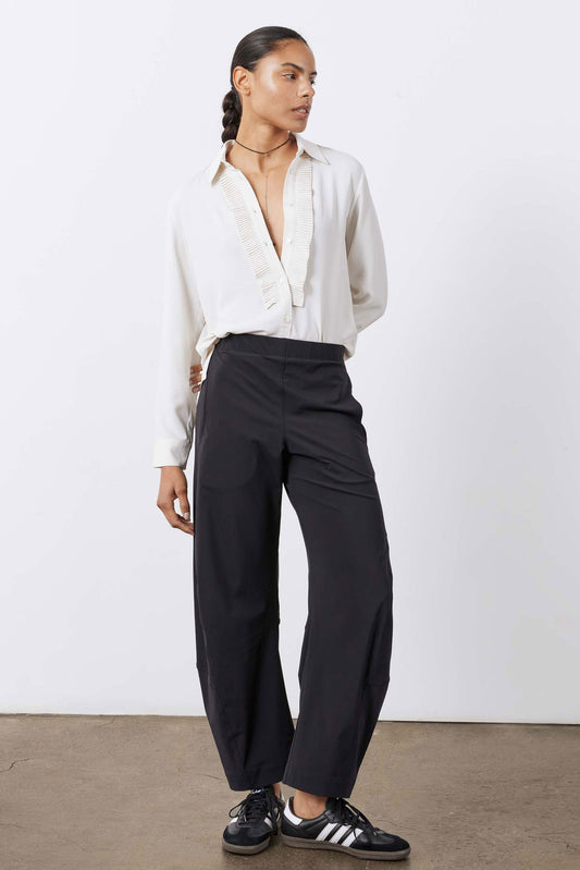 Off-white tux blouse with buttoned V-neck placket and long sleeves