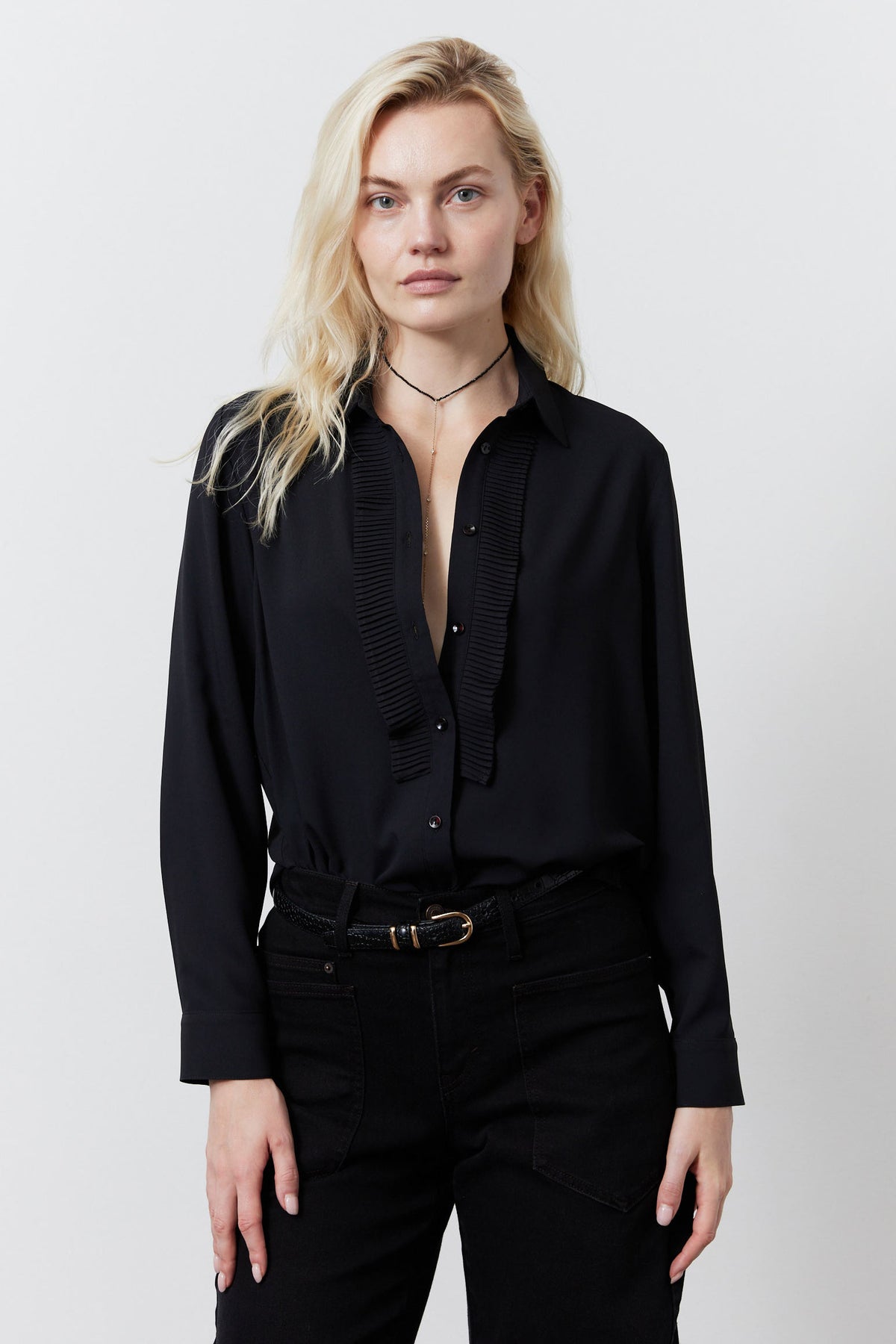 Black button-up blouse with point collar, ribbed front placket, long sleeves