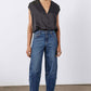 Indigo barrel-leg jeans with button fly, stitched seams, and cuffed hem
