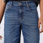 Indigo denim jeans waistband with button closure and belt loops