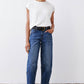 Indigo wide barrel-leg jeans with straight yoke seams and button-front closure