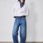 Indigo barrel-leg jeans with high rise, belt loops, and dark topstitching