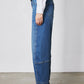 Indigo barrel-leg jeans, ankle-length wide leg with stitched side seams and hem