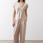 Champagne V-neck short-sleeve top with relaxed fit and draped neckline