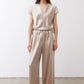Champagne wide-leg trousers with relaxed fit, elastic waist, and side pockets