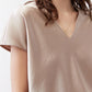 Champagne V-neck short-sleeve top with soft textured fabric