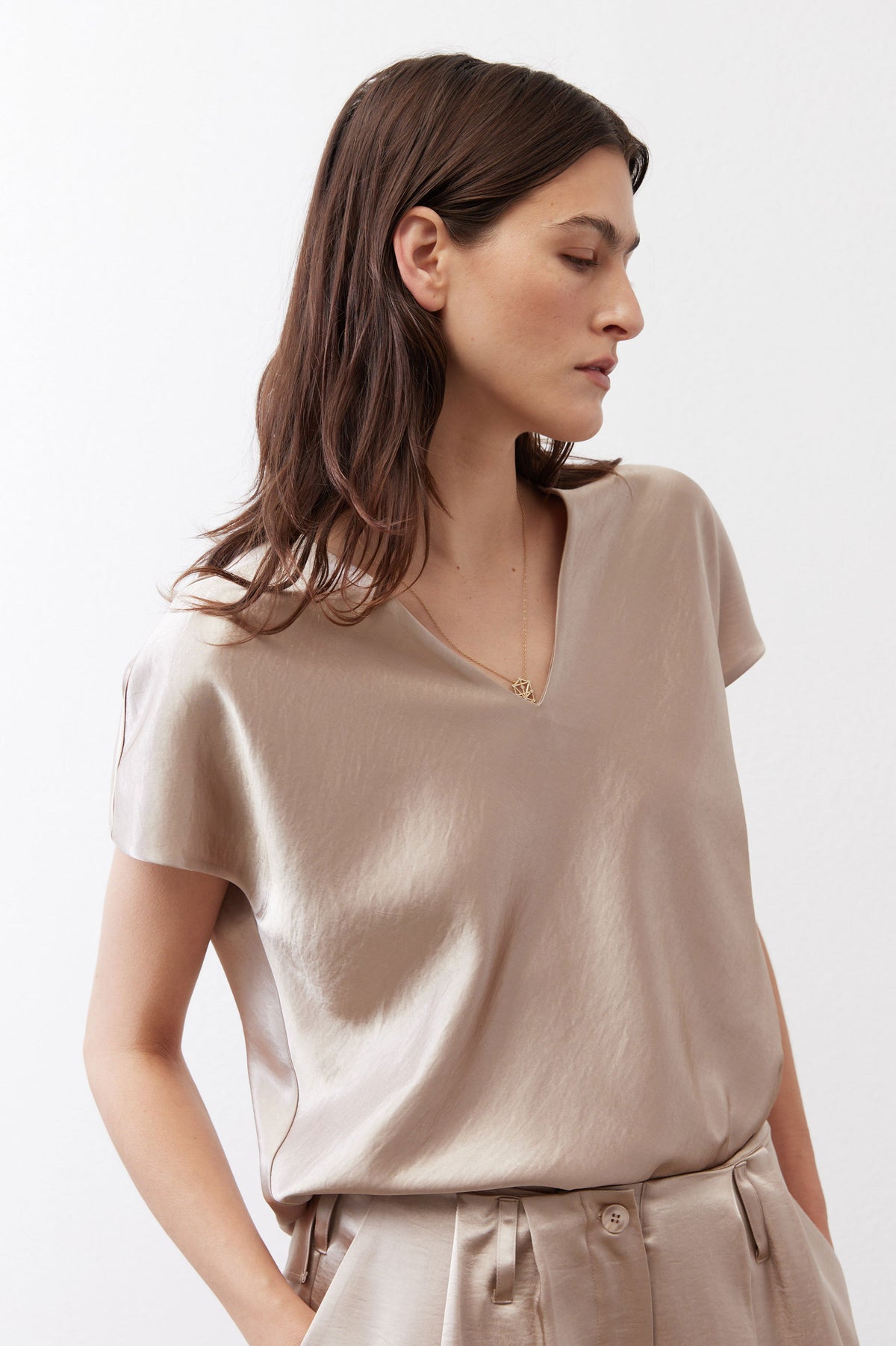 Champagne V-neck short-sleeve top with relaxed fit, side view