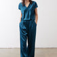 Deep teal V-neck short-sleeve top with waist tie detail