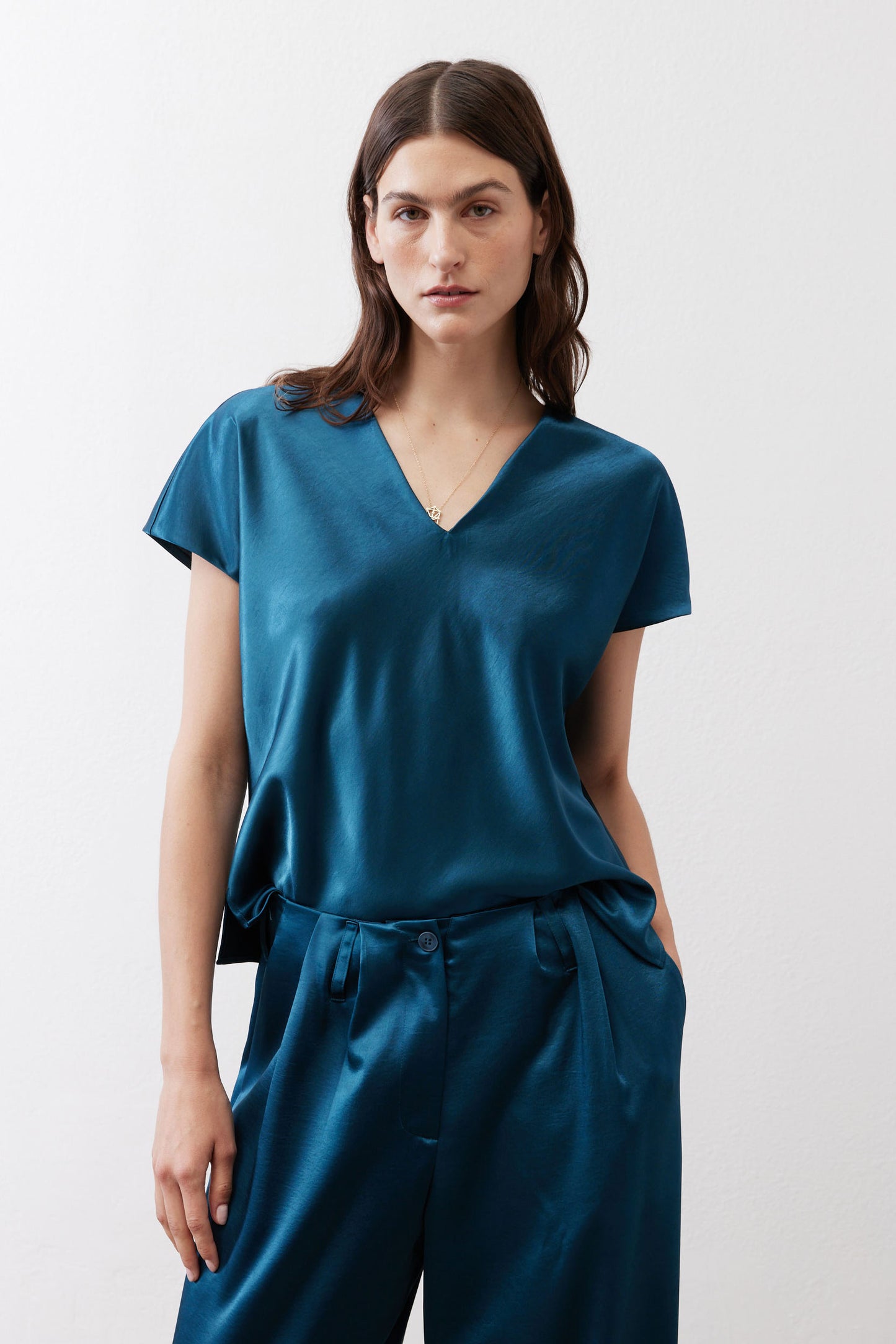 Deep teal V-neck short-sleeve top with draped neckline