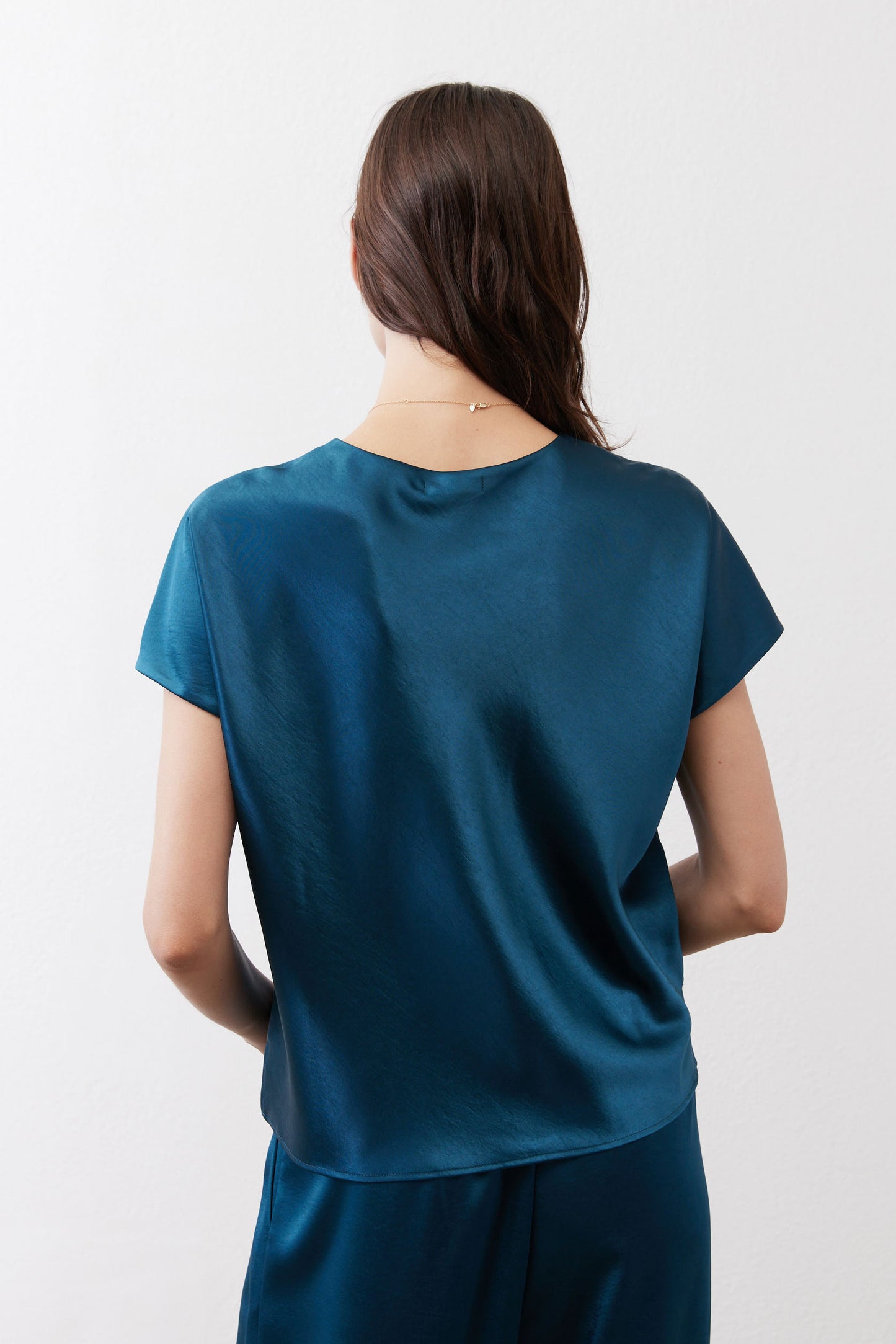 Deep teal short-sleeve top, back view