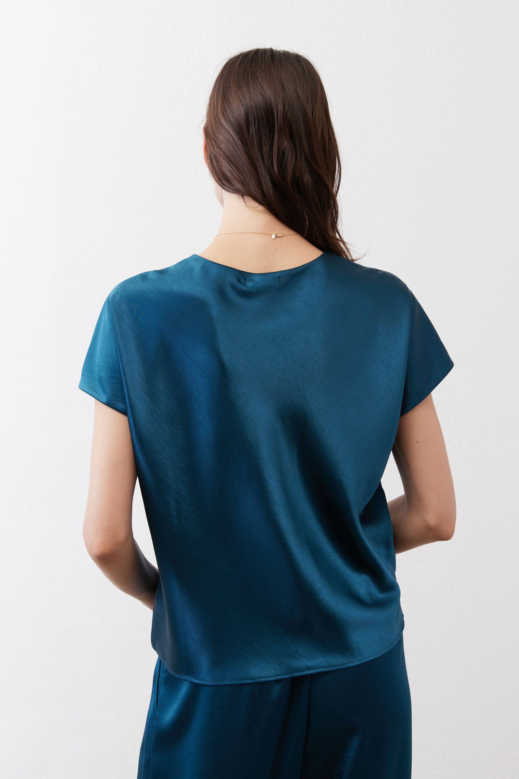 Deep teal short-sleeve top, back view