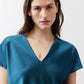 Deep teal V-neck short-sleeve top with smooth neckline