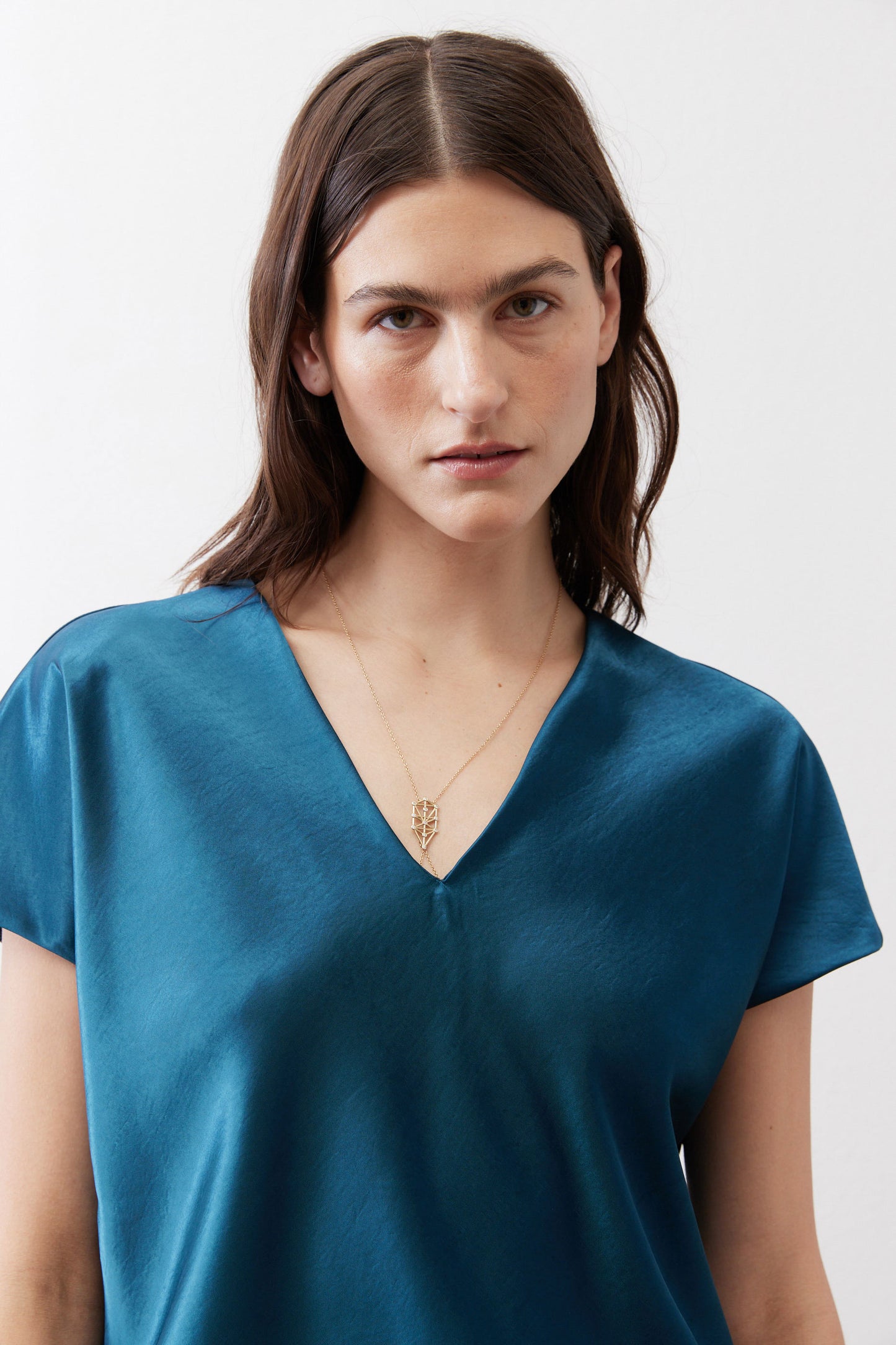 Deep teal V-neck short-sleeve top with smooth neckline