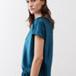 Deep teal V-neck short-sleeve top, relaxed side view