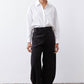 Black corduroy pants with high-rise waistband and loose barrel-leg cut